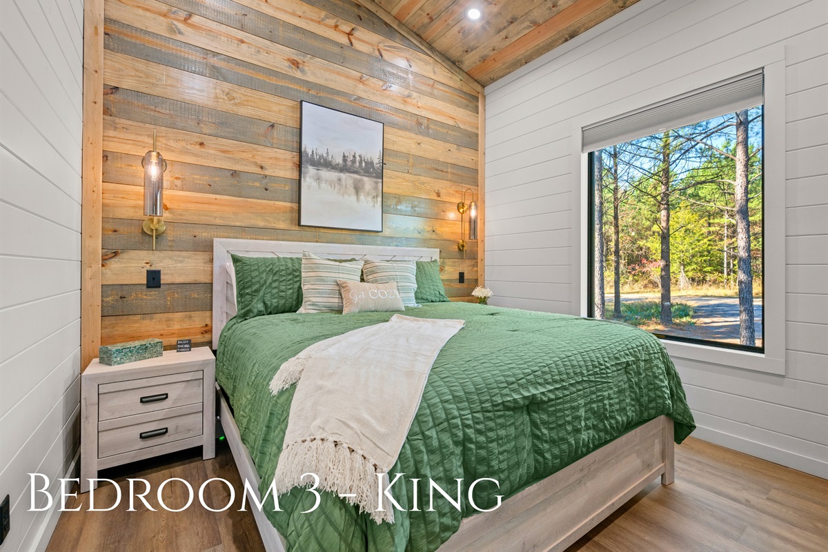A warm and inviting bedroom with wood accents and plush linens that make you want to linger just a little longer each morning.