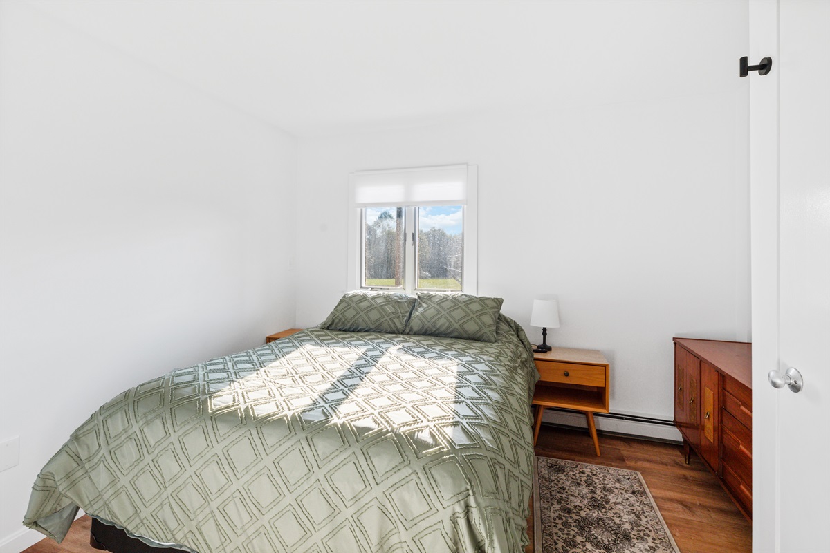 Downstairs Bedroom with queen bed and 50" Smart TV