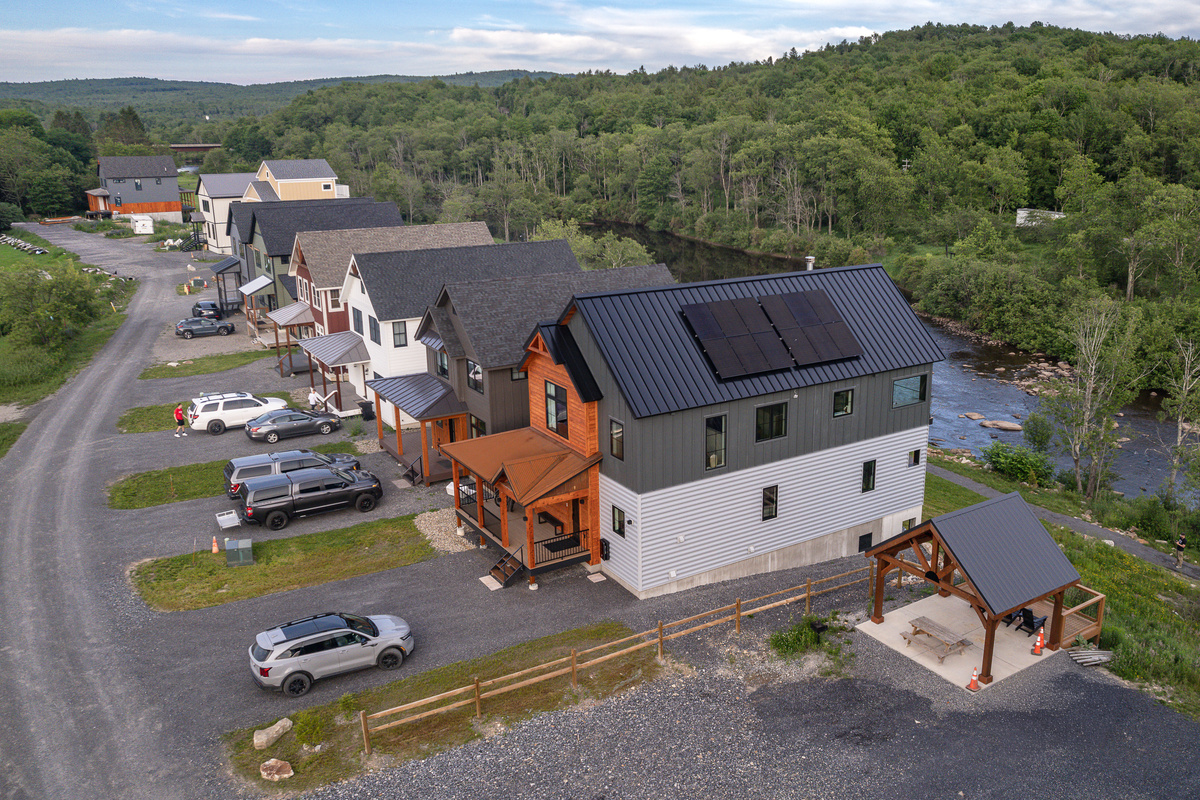 First house on the right. Pavilion, extra parking and charcoal grill next door. 