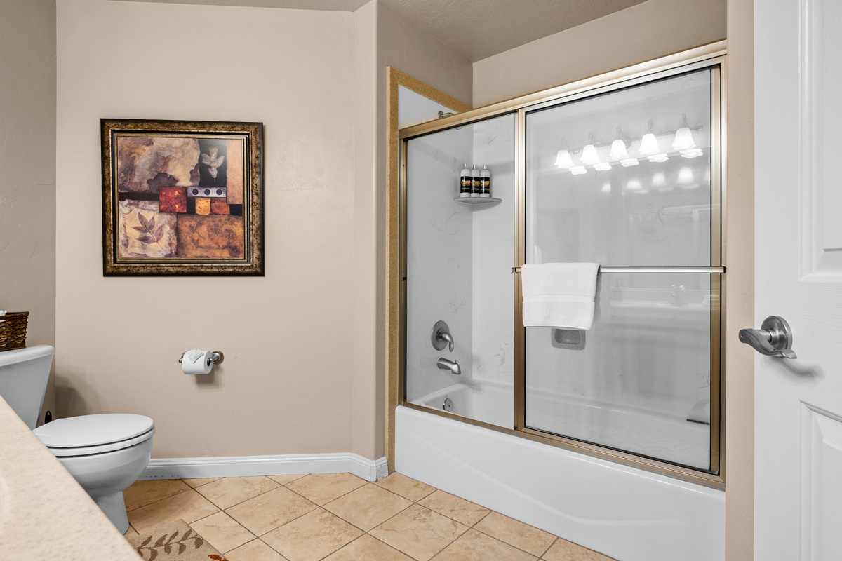 Clean and spacious full bathroom with vanity and walk-in shower for added convenience.