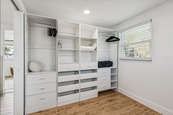 Large walk-in closet providing plenty of storage for extended stays
