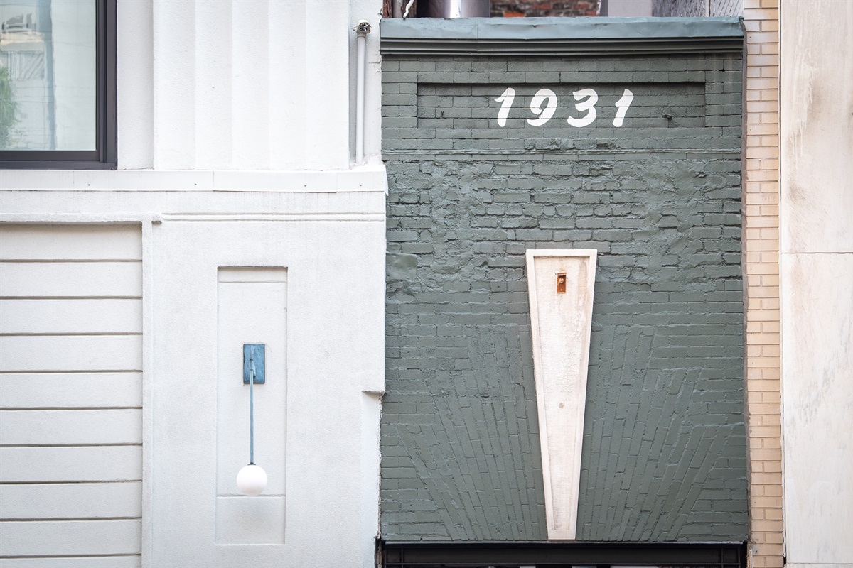 A secure gateway—guests enter through this sleek, black metal door, which leads to the private and contemporary comforts of your stay at 1931 2nd Avenue N