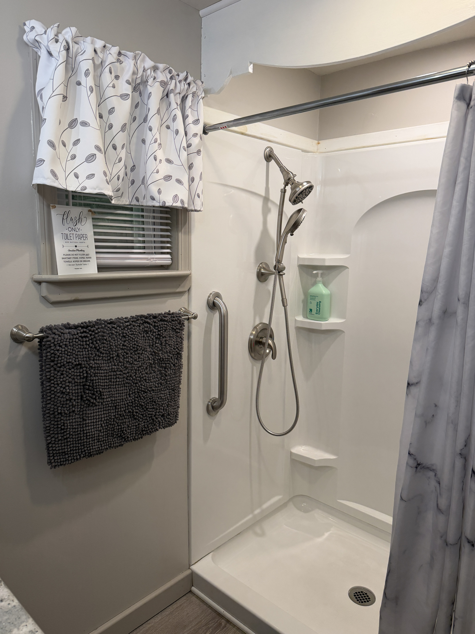 Main level bathroom off hallway w/ shower