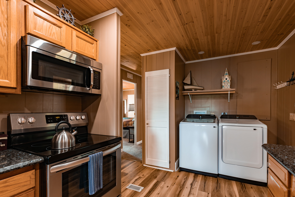 The kitchen includes full-size appliances, with a washer and dryer close by for longer family getaways.