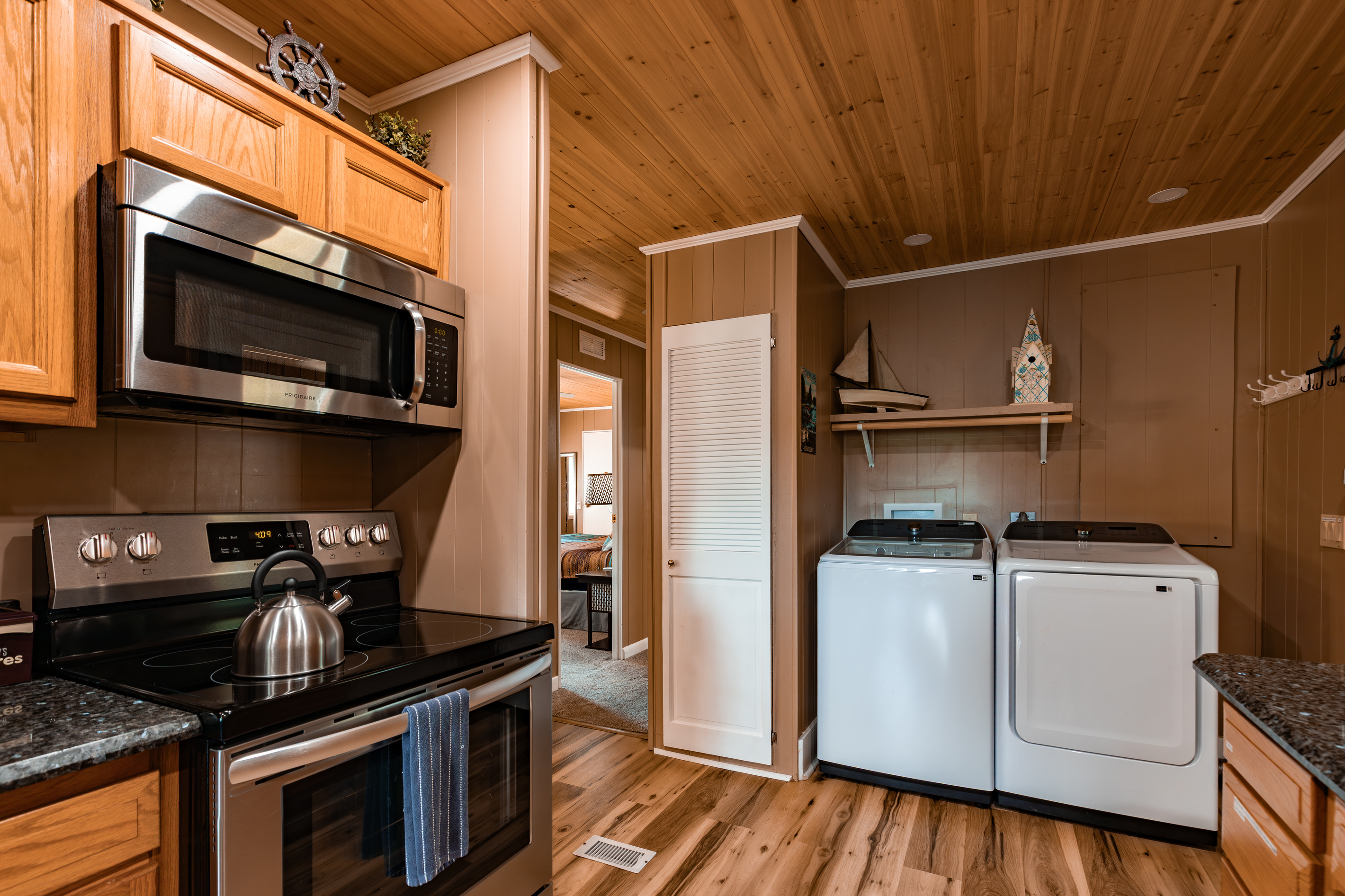 The kitchen includes full-size appliances, with a washer and dryer close by for longer family getaways.
