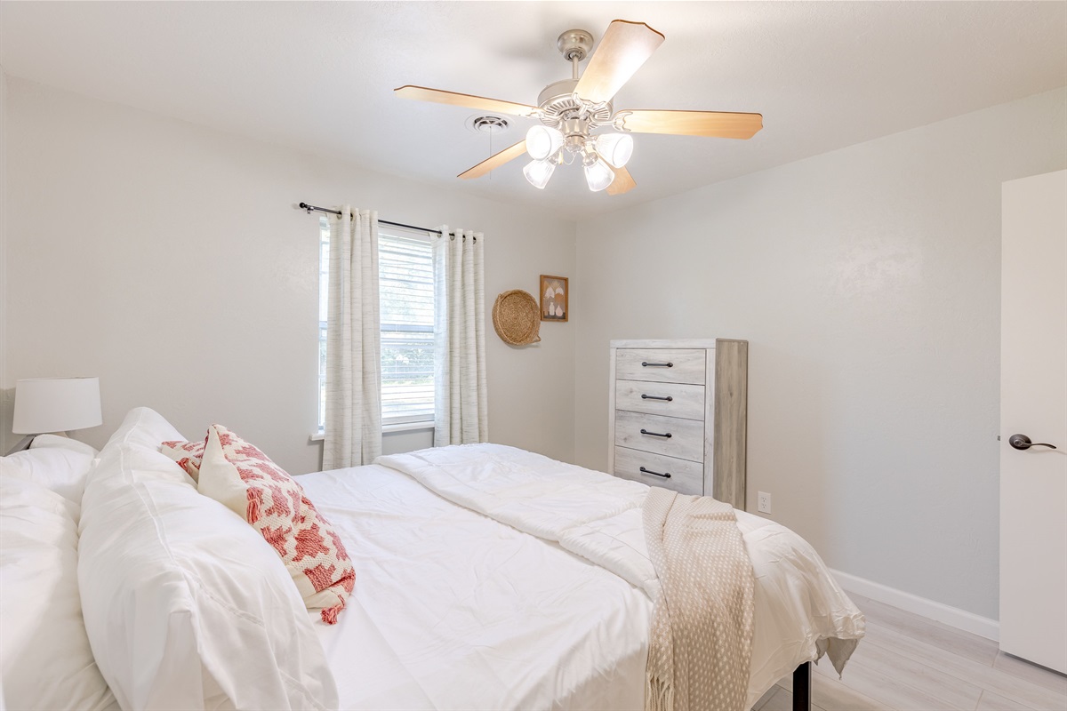 Your getaway starts here: master suite featuring a cozy king bed.