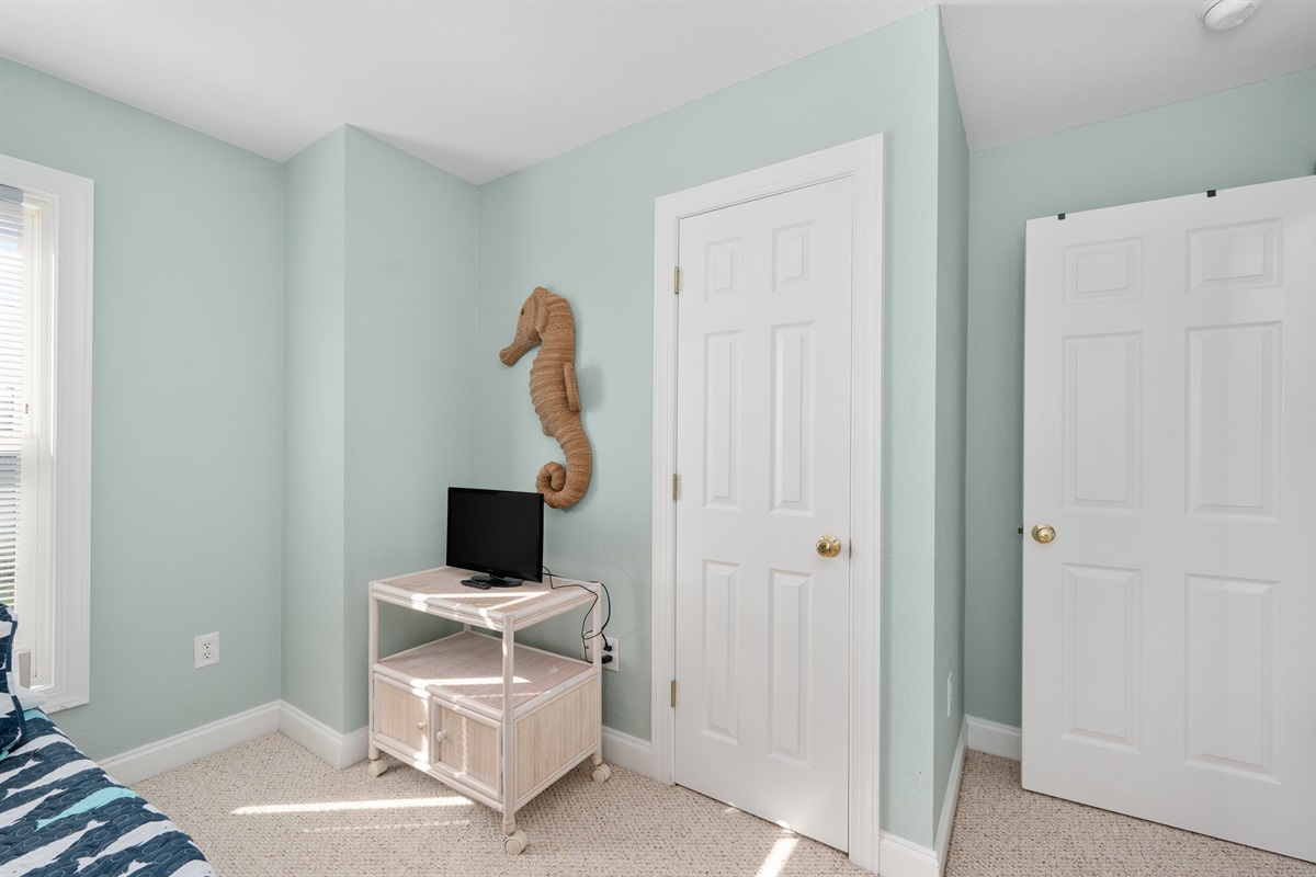 Cozy bunk room with a TV for movies and downtime.