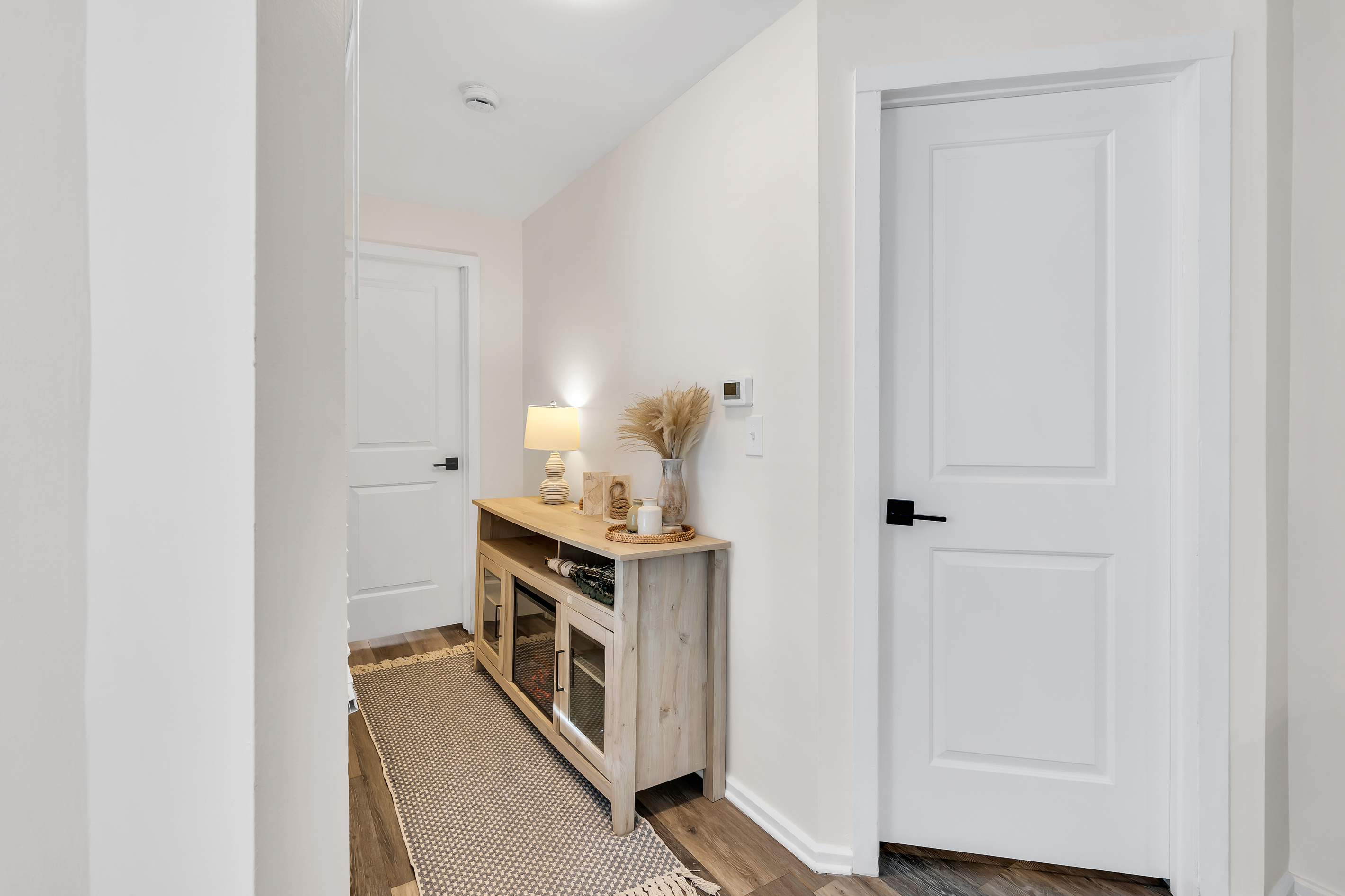 Find your way around in seconds. The bright hallway ties the apartment together, with everything you need, including an electric fireplace, just a few easy steps from one another.
