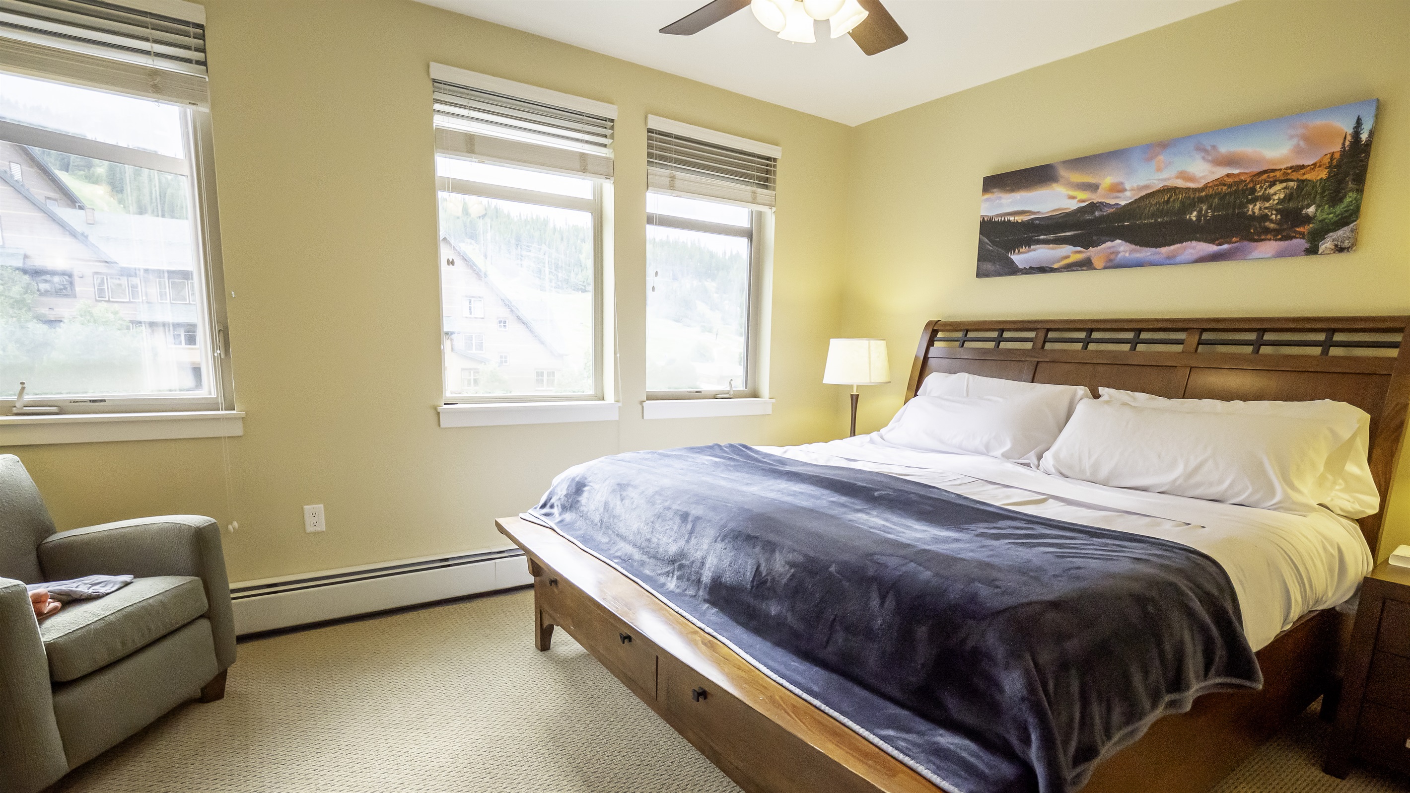 king sized bed, blackout blinds on windows