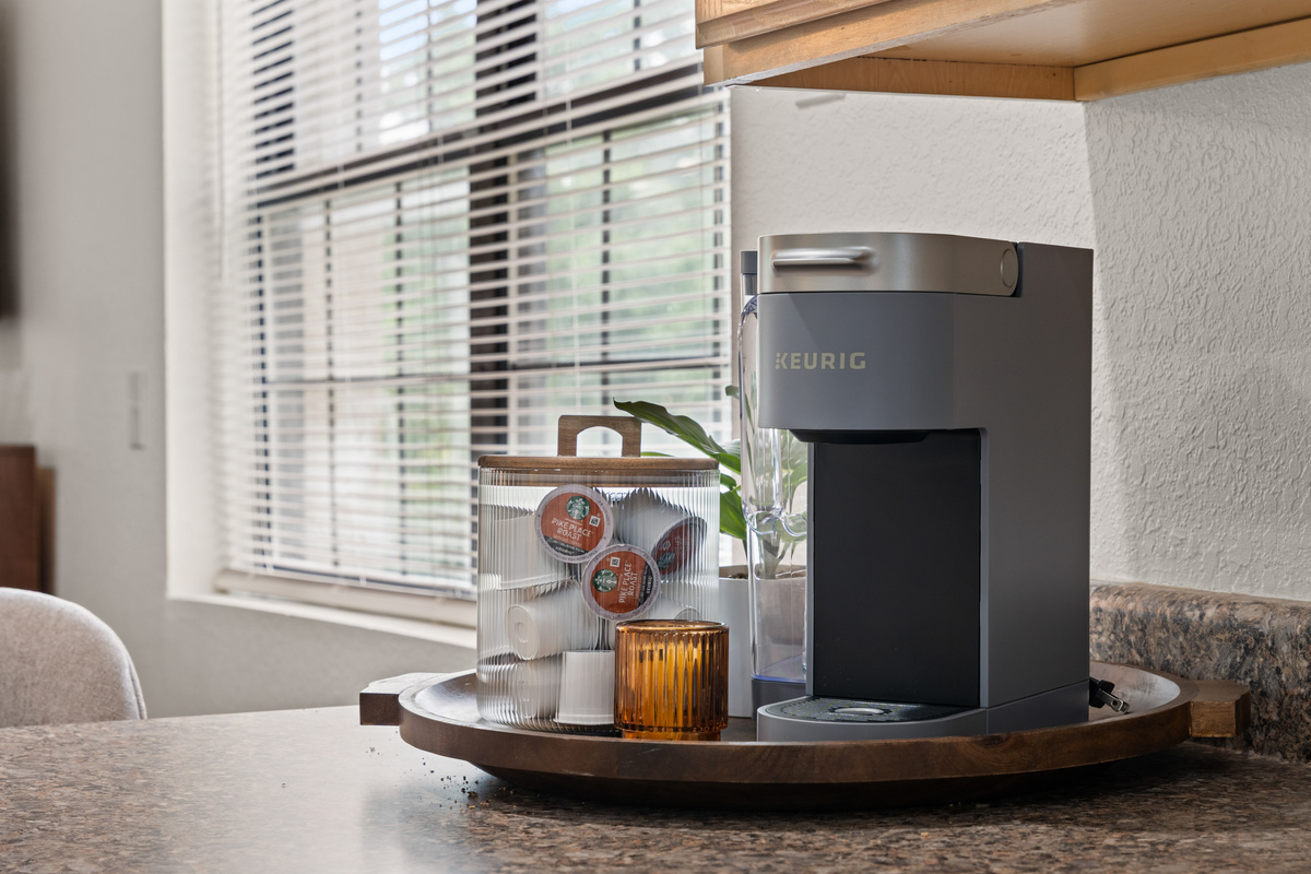 Choose between a Keurig and drip coffee maker. Bring preferred K-Cup pods; starter ground coffee, cream, and sugar are provided.