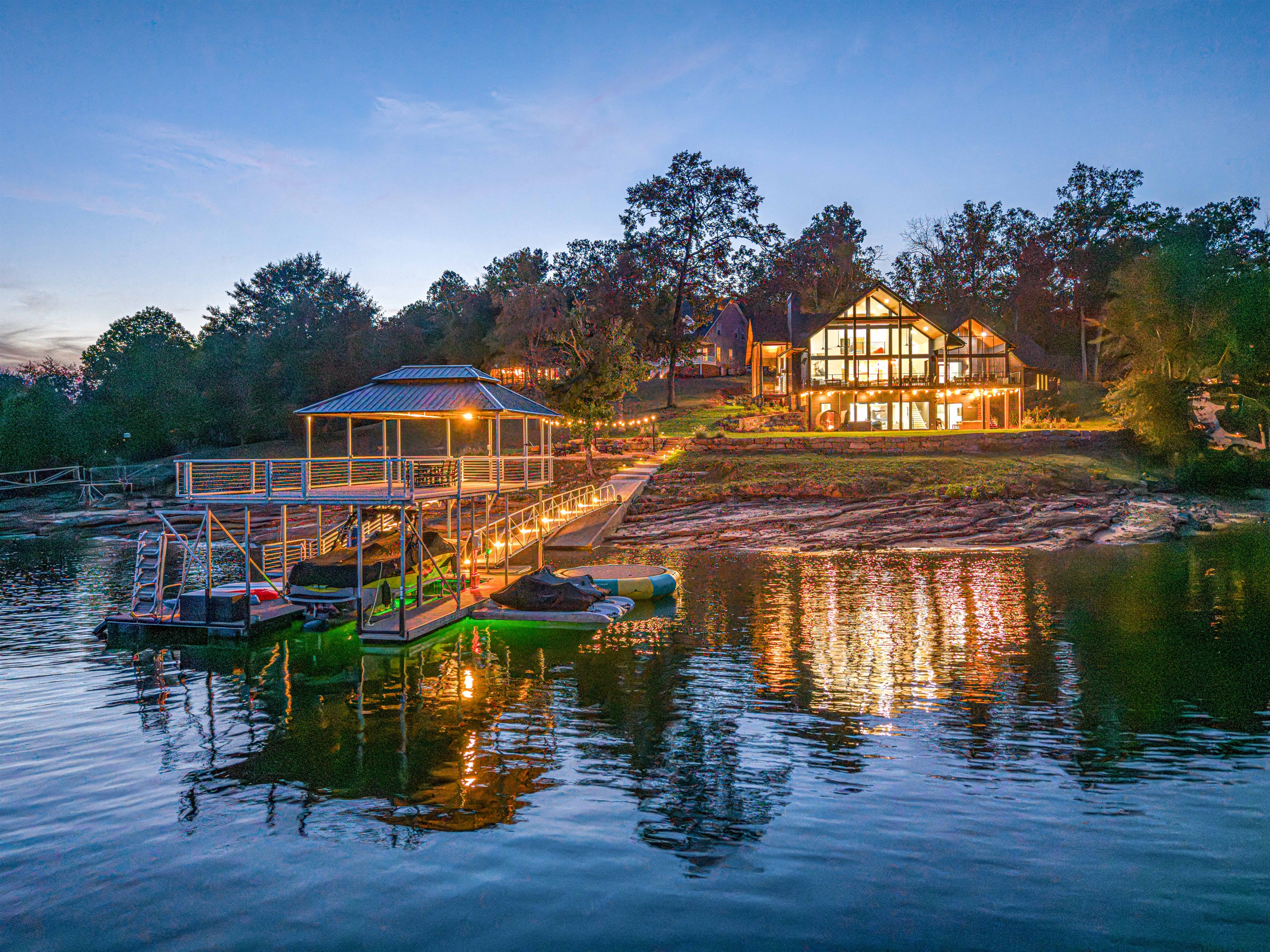 Picture returning after a night boat ride — your family walking up the dock toward the glowing home.