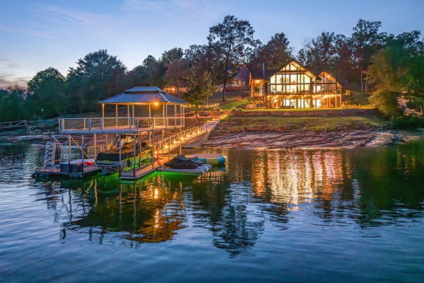 Picture returning after a night boat ride — your family walking up the dock toward the glowing home.