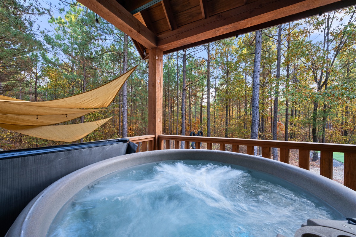 Soak away your worries in our private hot tub, nestled among the pines
