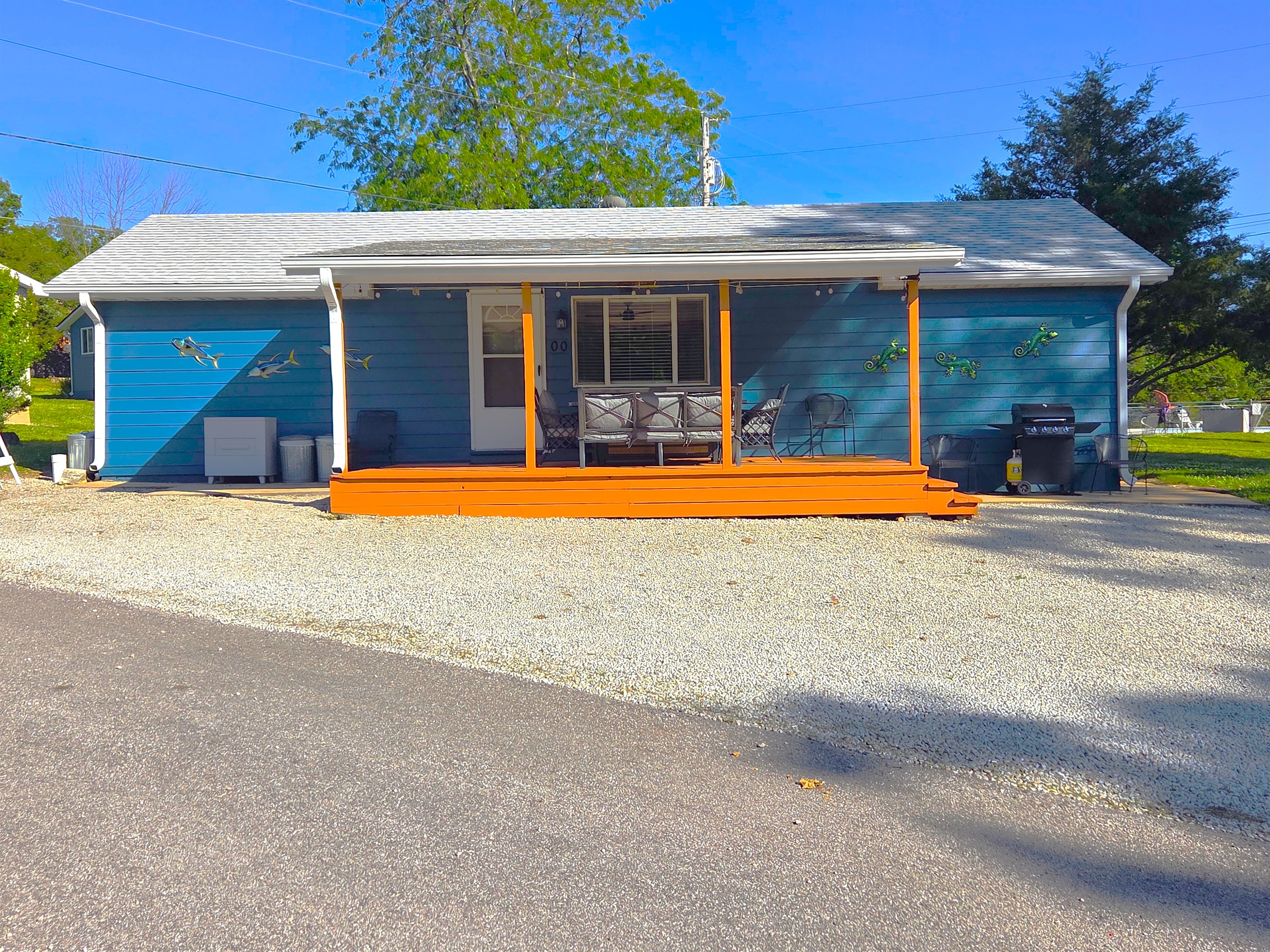 Such a fun place to stay! Newly stained spacious front porch is a perfect hangout for all with lake views!