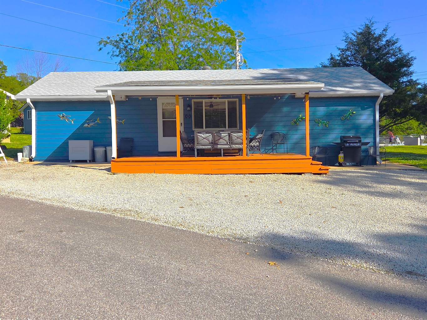 Such a fun place to stay! Newly stained spacious front porch is a perfect hangout for all with lake views!