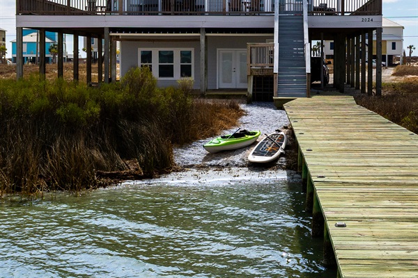 Back of home with private dock and beach faces Lagoon
