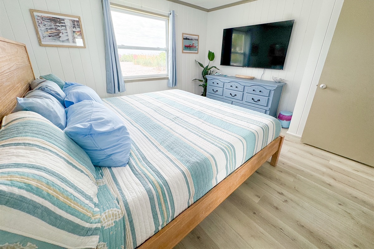 Colorful Primary Bedroom w/65" TV