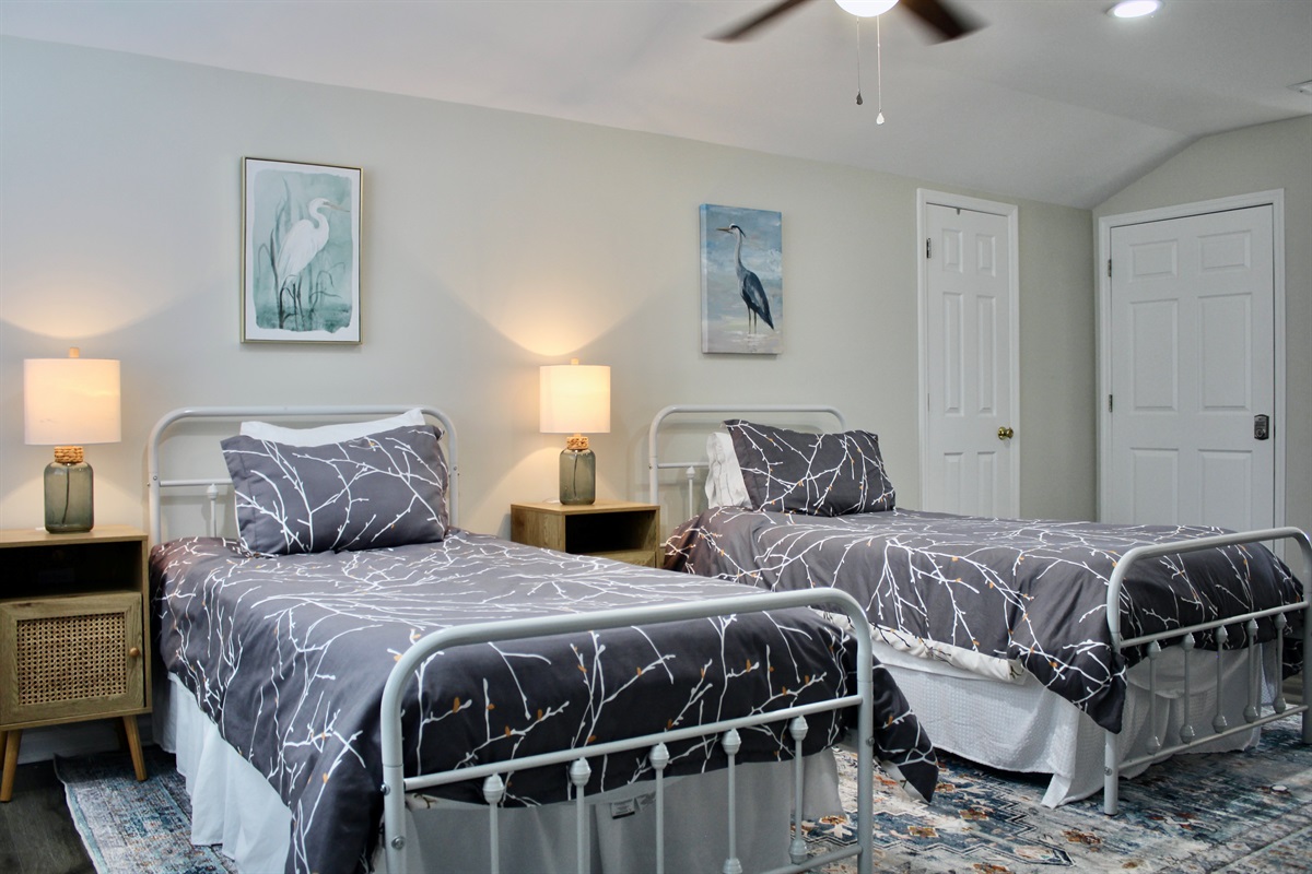 Comfort meets charm in this loft bedroom—ideal for siblings, friends, or a quiet getaway.