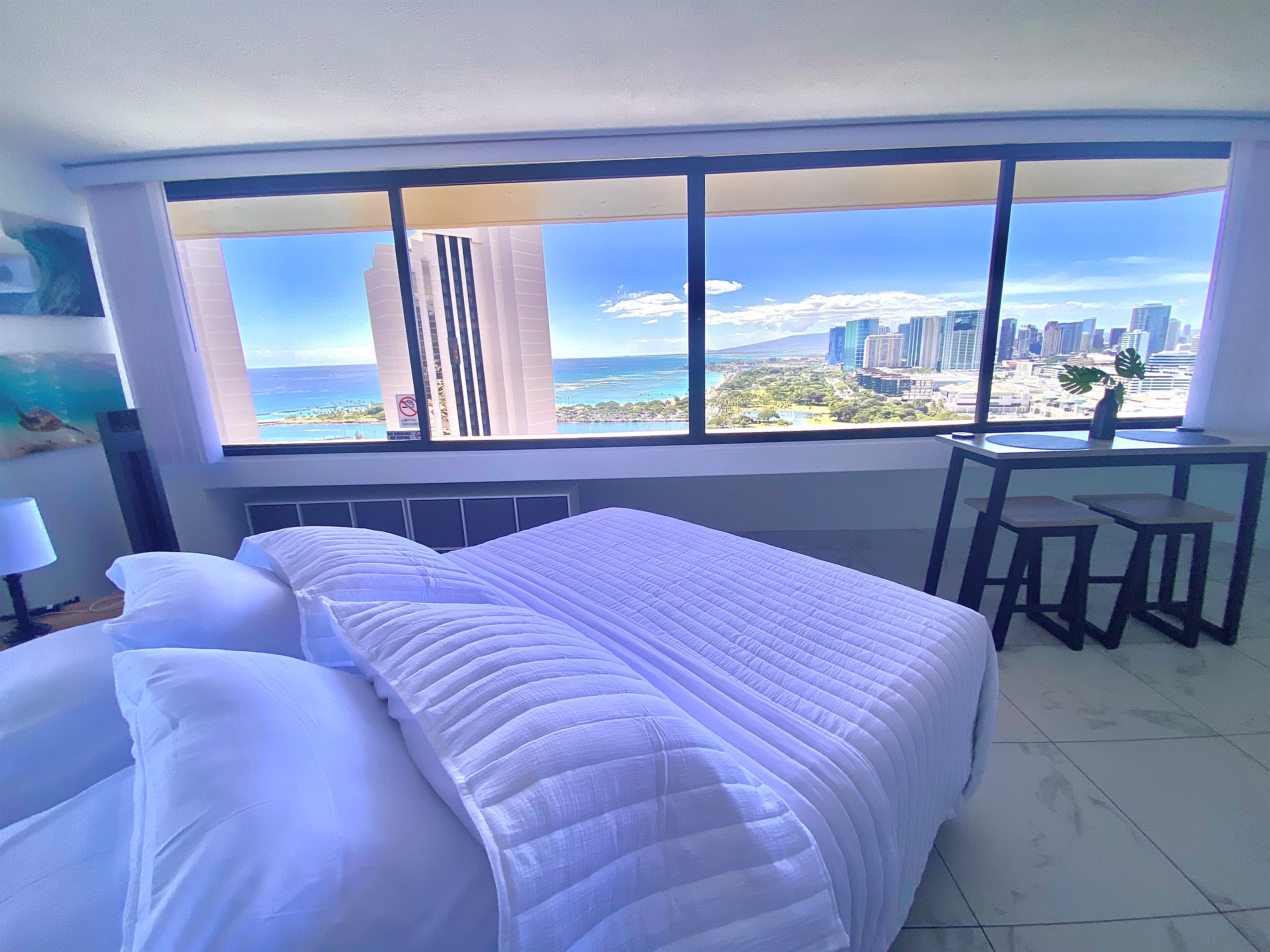 Wake up to panoramic views of the Pacific Ocean and Honolulu skyline right from your bed. This bright and airy Waikīkī suite combines comfort, elegance, and breathtaking scenery — the perfect setting for your island escape.