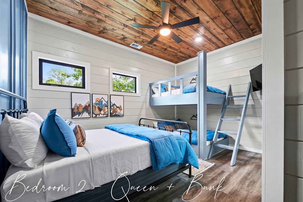 Cozy up in Bedroom 2 – where comfort meets style with a plush queen bed and charming bunk, perfect for sweet dreams after a day of adventures.