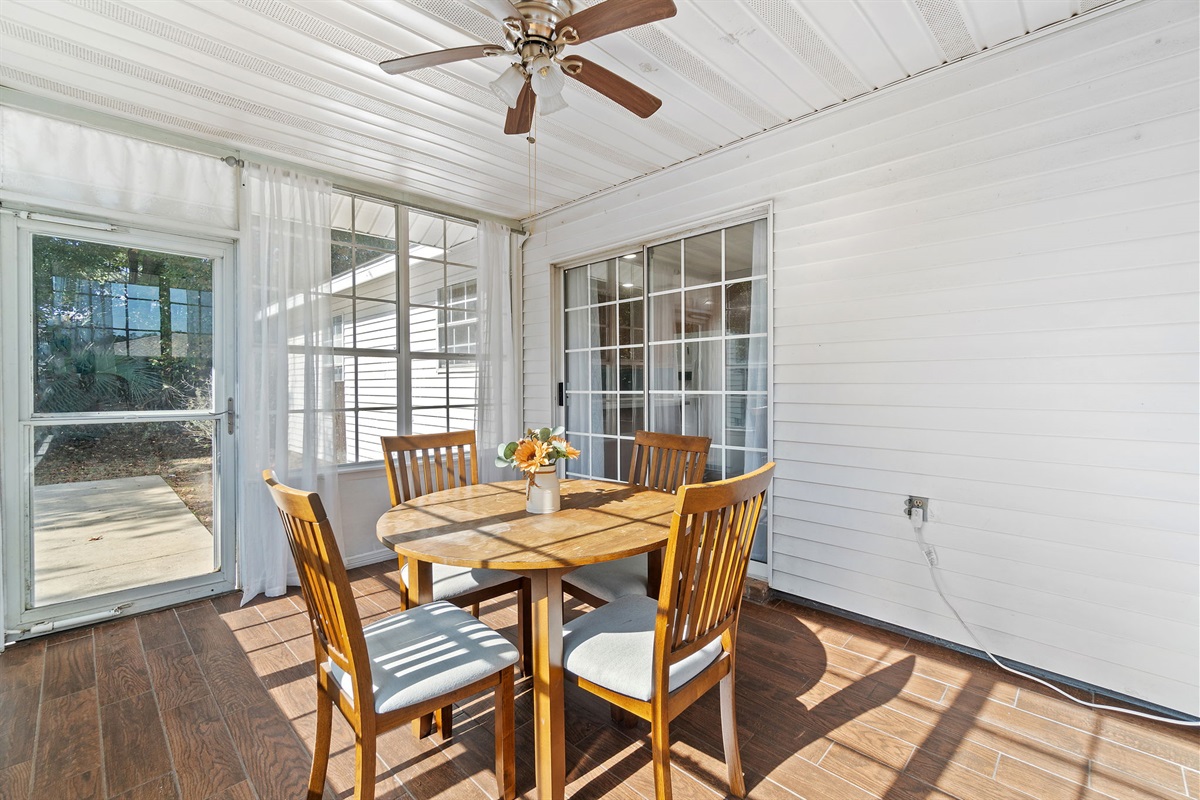This enclosed patio space offers a charming dining nook bathed in natural light. Whether you’re starting your day or enjoying an evening meal, the peaceful atmosphere and garden views make it a guest favorite.