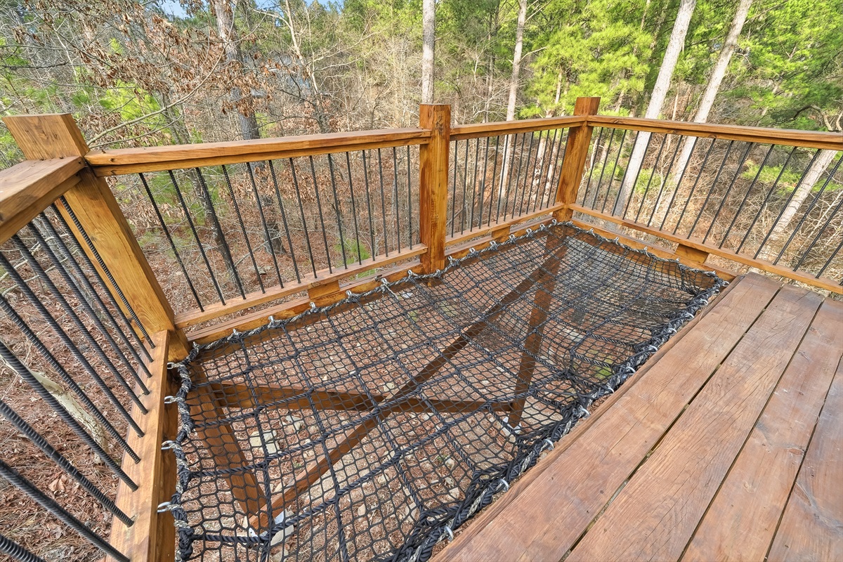 Relax or stargaze in the elevated cargo net hammock. 