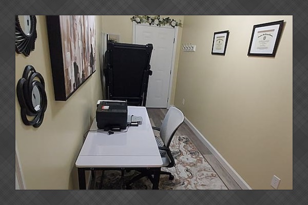 This space can easily convert into an additional sleeping area — just roll the desk aside and set up the floor mattress, complete with cozy bedding.