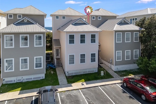 Our three-story townhouse sits directly on 30A and is right across the street from public beach access.  It has two dedicated parking spaces and may provide additional parking as available.
