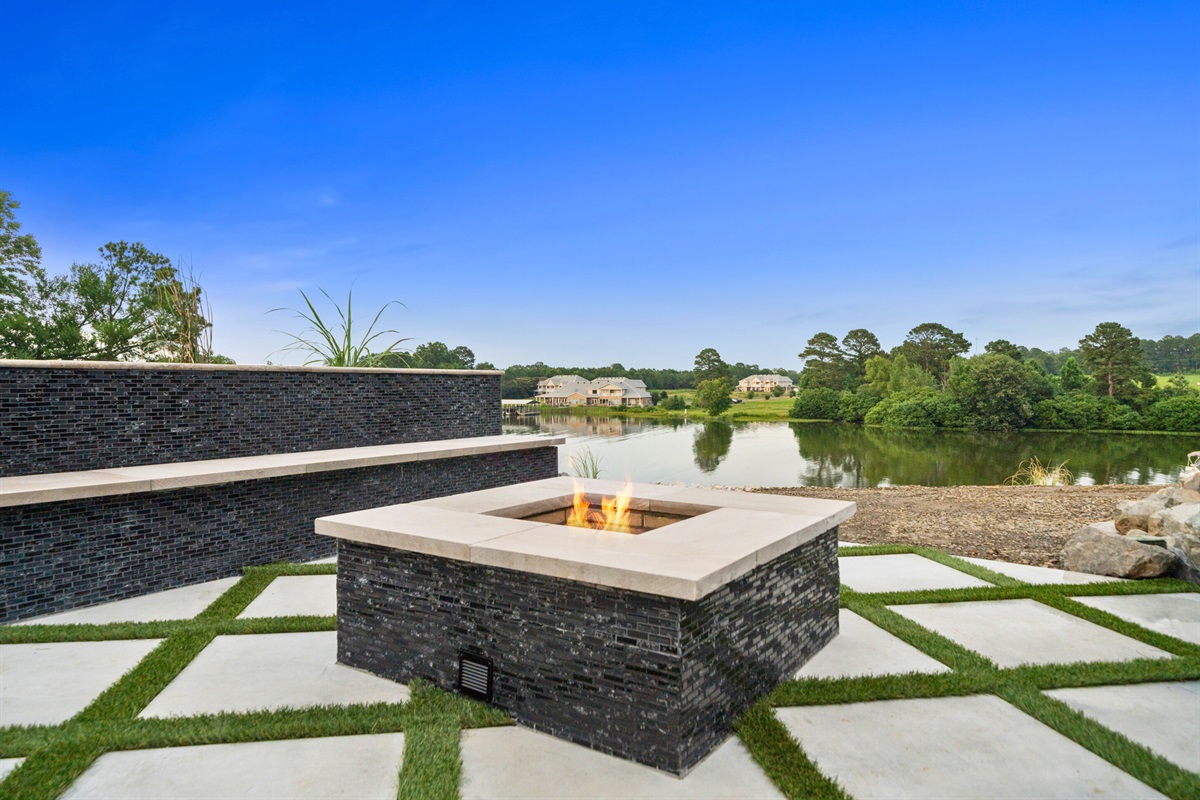 Relax by the fire pit with loved ones, taking in the picturesque lake views and enjoying the comfort of a crackling fire