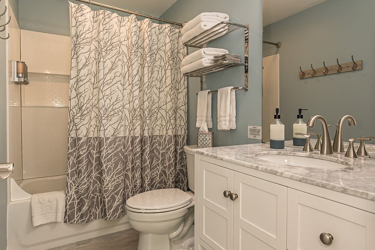 This bathroom is attached to bedroom 5. It has a tub/shower combo.