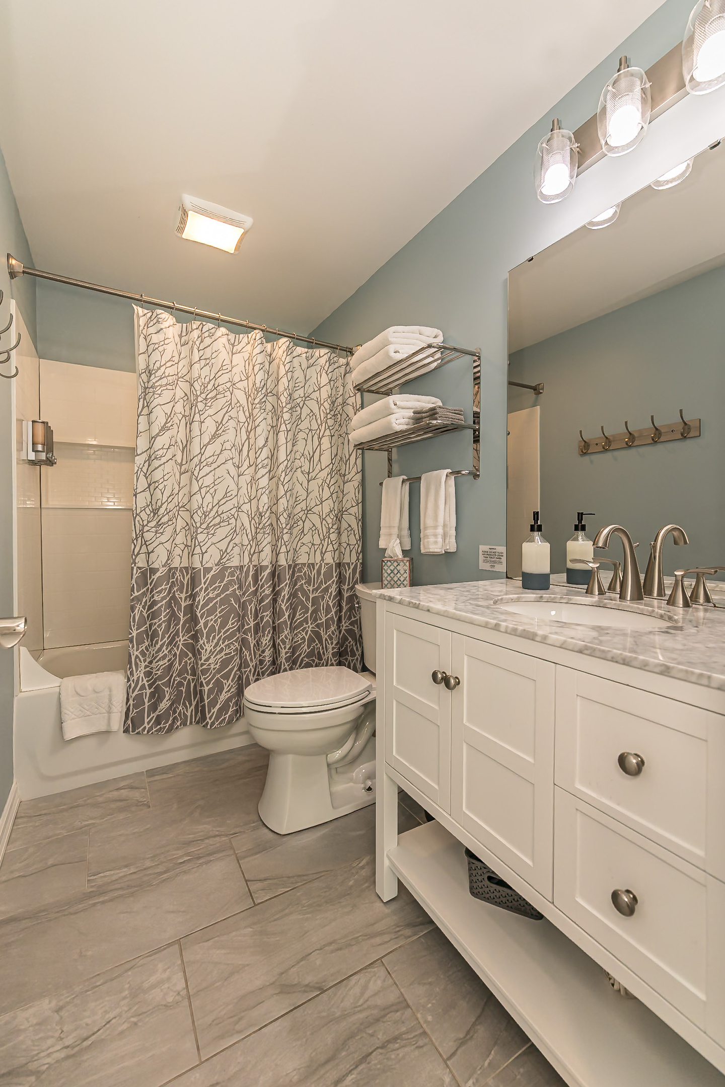 This bathroom is attached to bedroom 5. It has a tub/shower combo.
