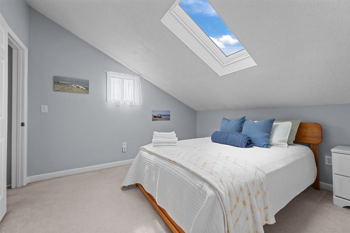 Skylight views by day and a comfy queen bed by night&mdash;your private loft retreat