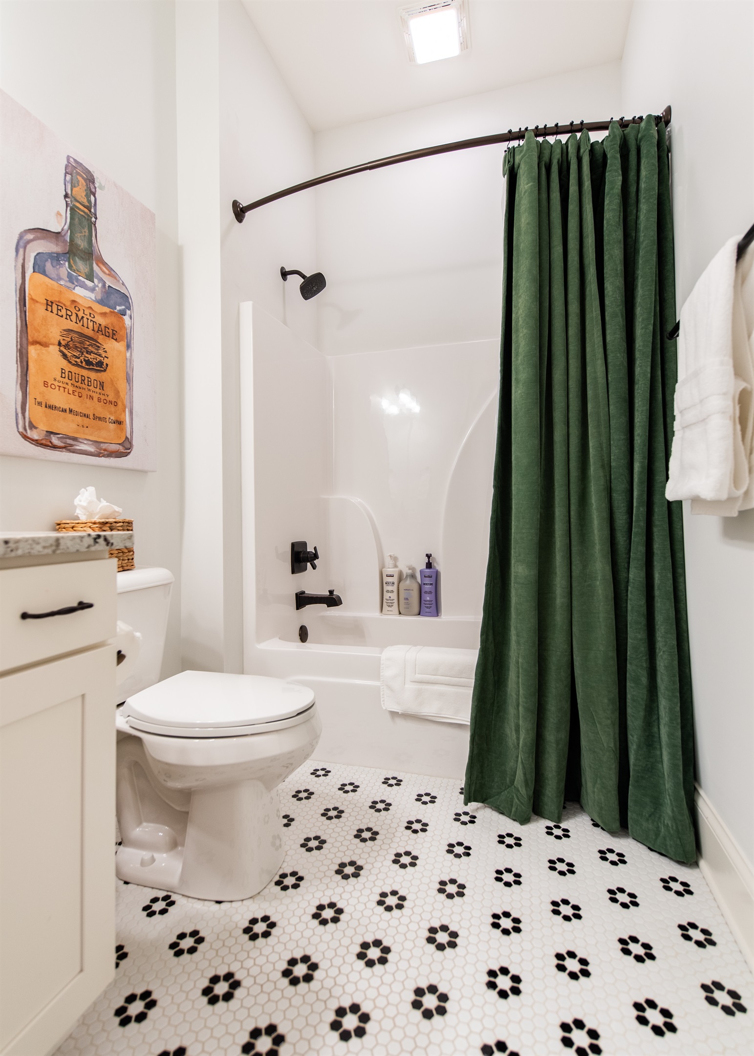 Sleek, modern toilet and tub for comfort and convenience in the bathroom.