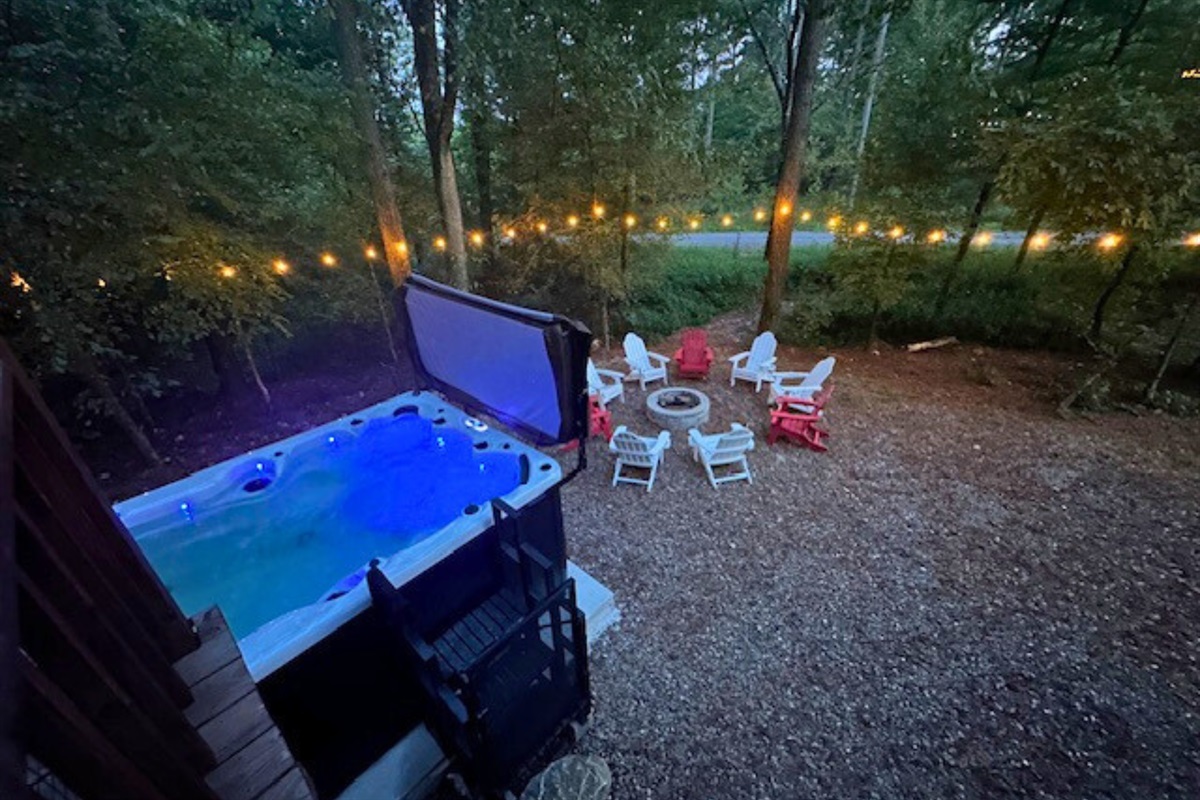 Gather with friends around the fire pit, complete with cozy Adirondack chairs and string lights.