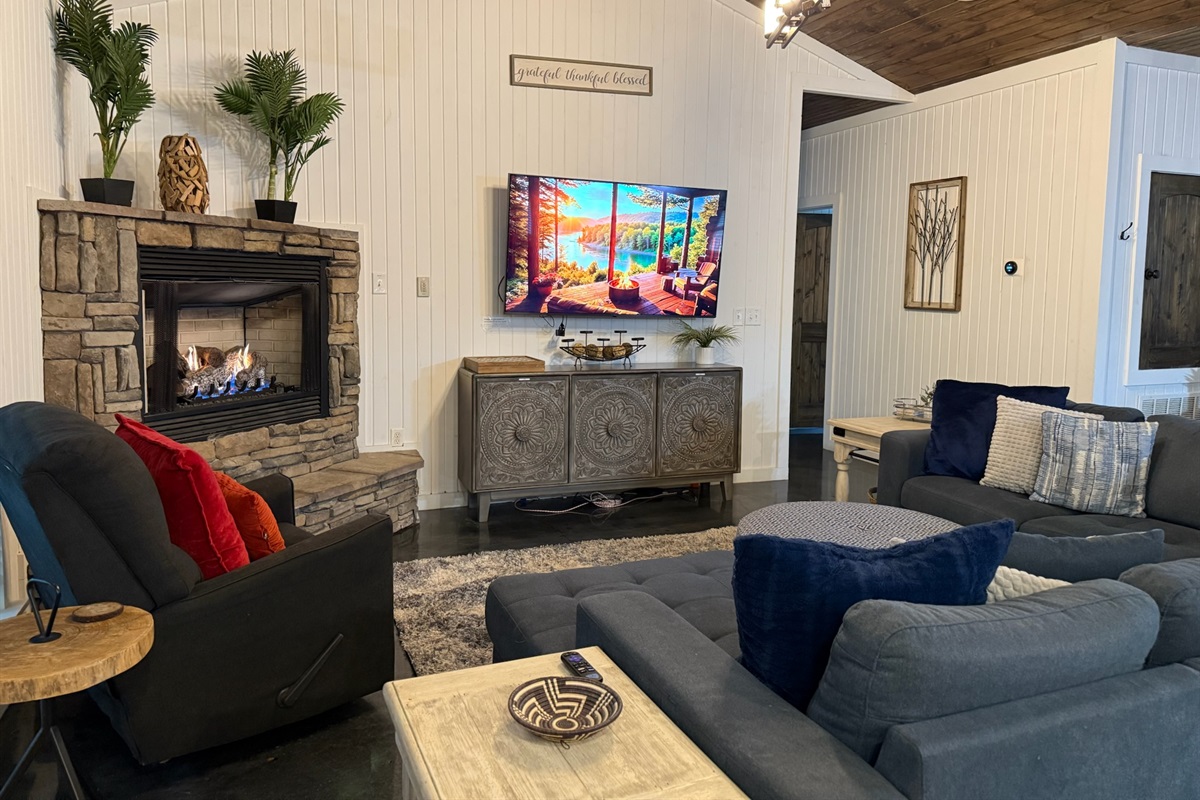Lounge fireside with smart TV & plush seating