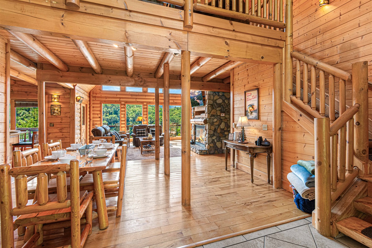 Main Level Dining Room: Experience rustic elegance with mountain views and log cabin charm!