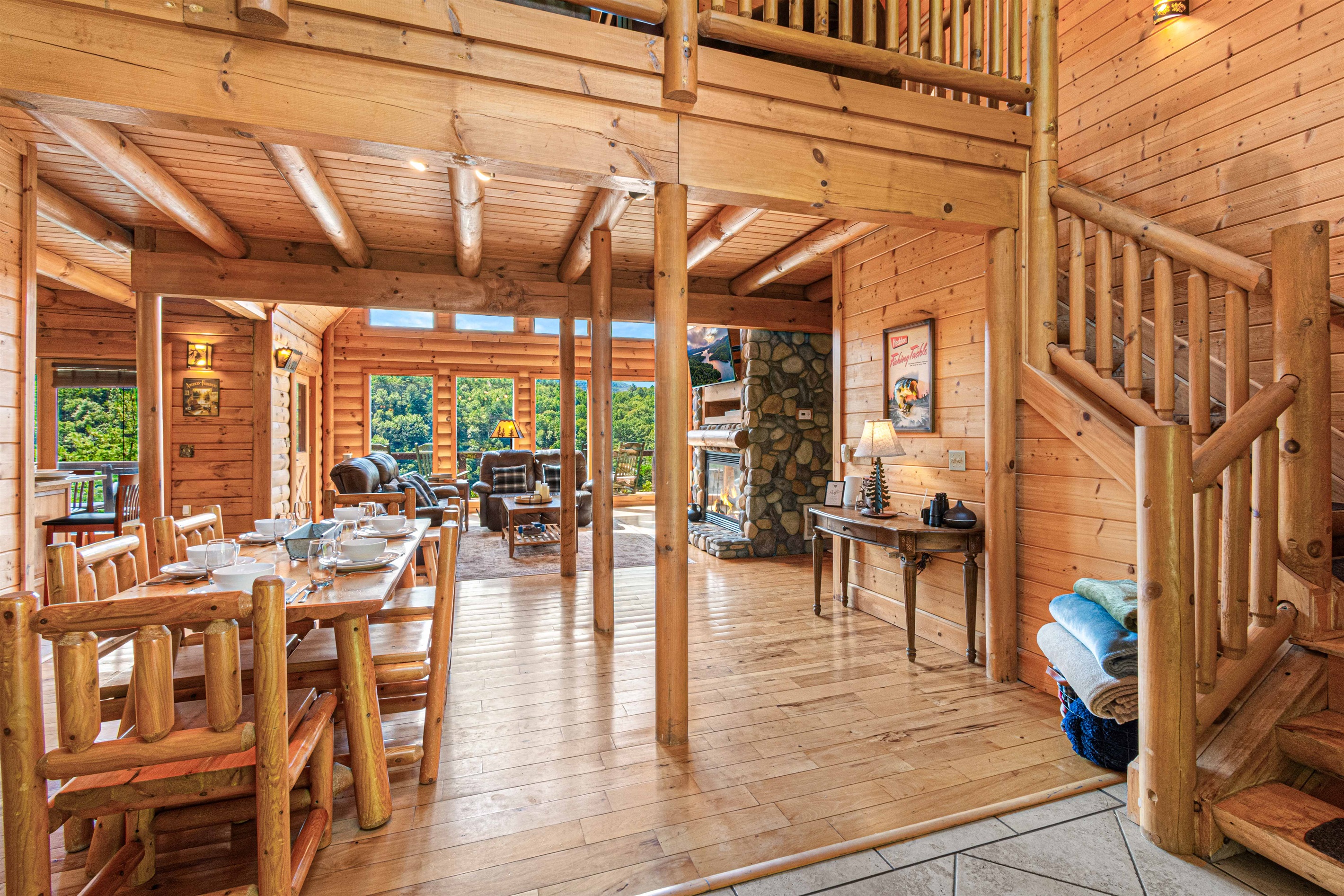 Main Level Dining Room: Experience rustic elegance with mountain views and log cabin charm!