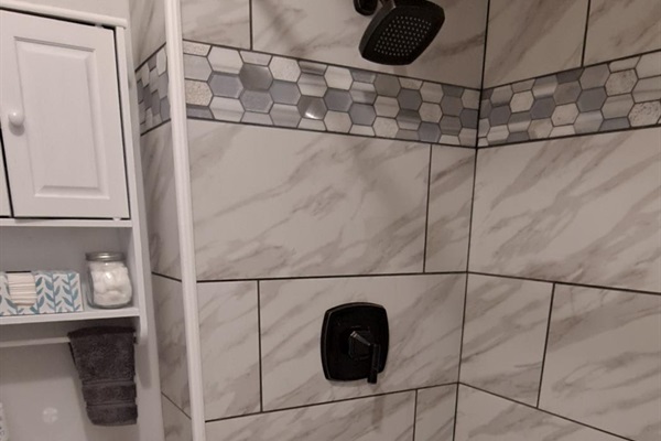 Spa-like bathroom with deluxe amenities and tub