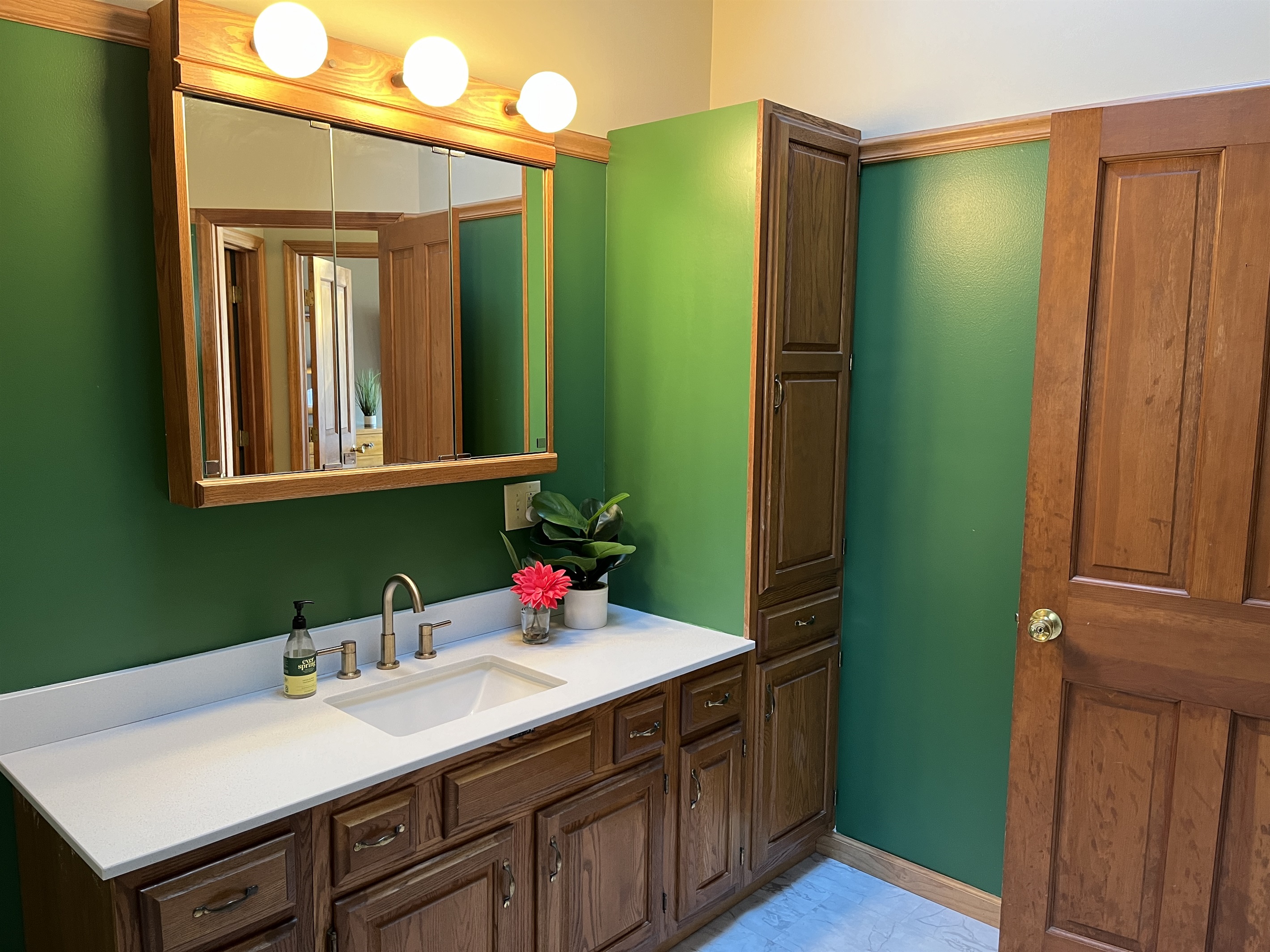 Camp Havon 2nd floor full bathroom has lots of storage and fully equipped with towels for guests.