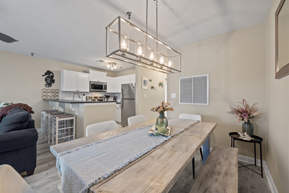 Share meals and make memories in this inviting dining space overlooking the open-concept kitchen and living area