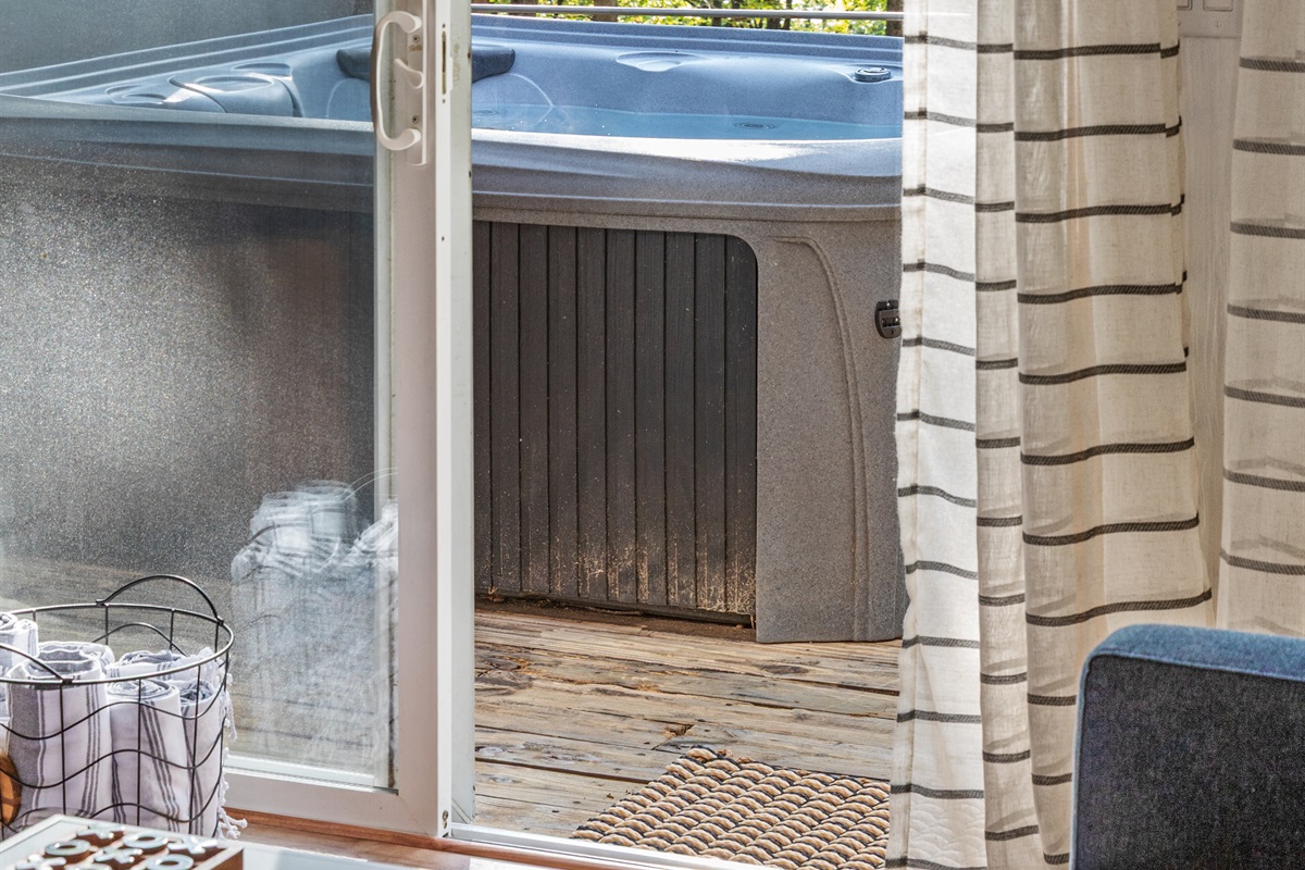 View of hot tub outside of living room