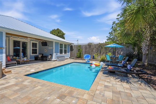 Relax in the pool or hot tub after a long day at the beach in the fully equipped backyard with grill, firepit, table, bean bags, tanning loungers, pool toys, basketball, your favorite shows, or just stay in your own private oasis for the day and enjoy!