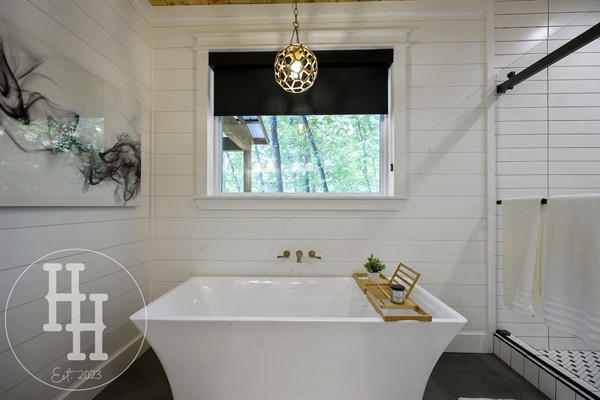 Window over the tub for natural light to view the trees or privacy shade.