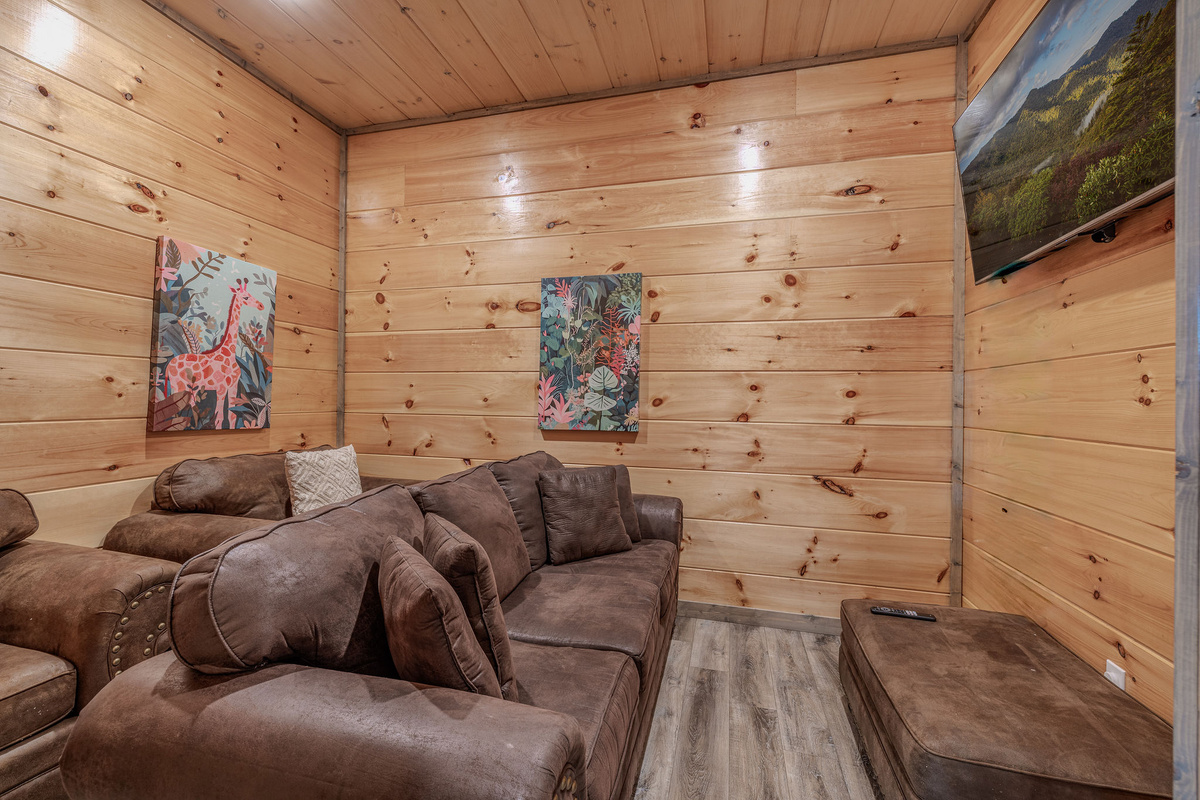 The lower-level theater gives guests a separate entertainment space away from the main living room.