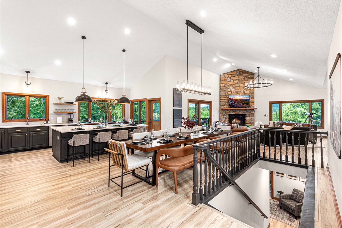 Dine and entertain in style—an open-concept kitchen, long farmhouse table, and fireside living room all flow together, designed for gathering and celebrating with ease.🍴🍷✨