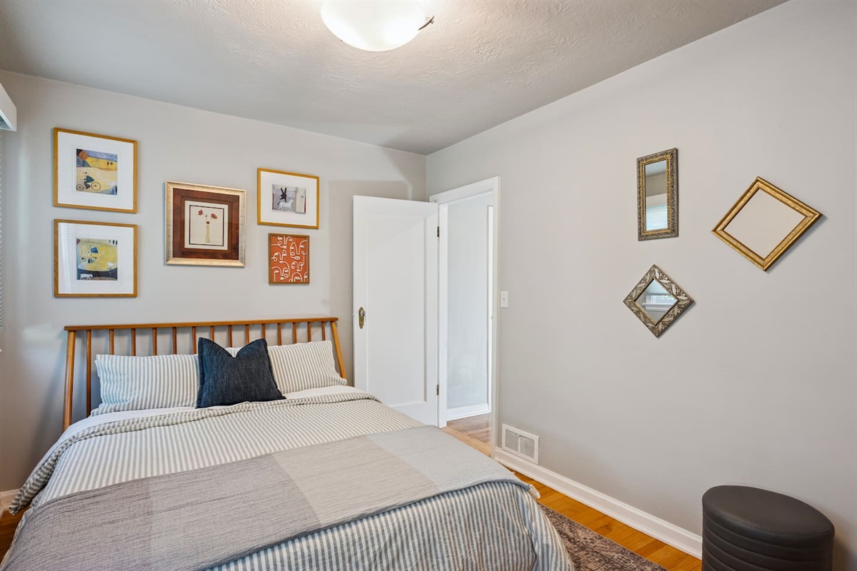 Upstairs bedroom outfitted with queen size bed