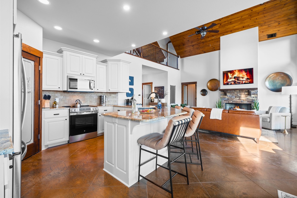 Whether you&rsquo;re cooking, chatting, or just enjoying the fireplace view from the kitchen, everything feels connected and inviting.