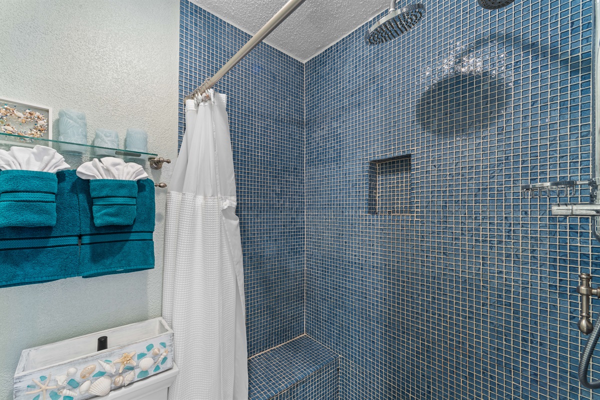 Combination tub/shower for flexible bathing options after a beach day.