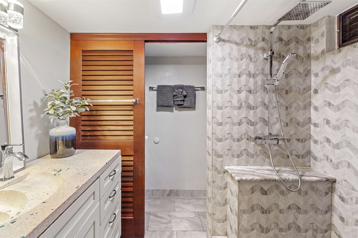 Full bathroom with step in shower and laundry. 