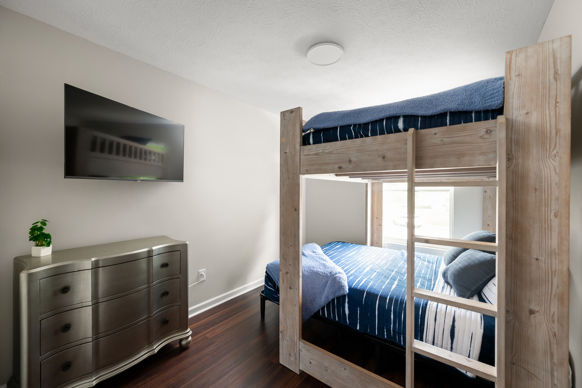 Perfect for kids, friends, or additional guests, Bedroom 4 features a full-over-queen bunk bed and a Smart TV, creating a fun and comfortable space for everyone to enjoy.